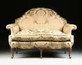 A QUEEN ANNE STYLE MAHOGANY SILK UPHOLSTERED SETTEE,