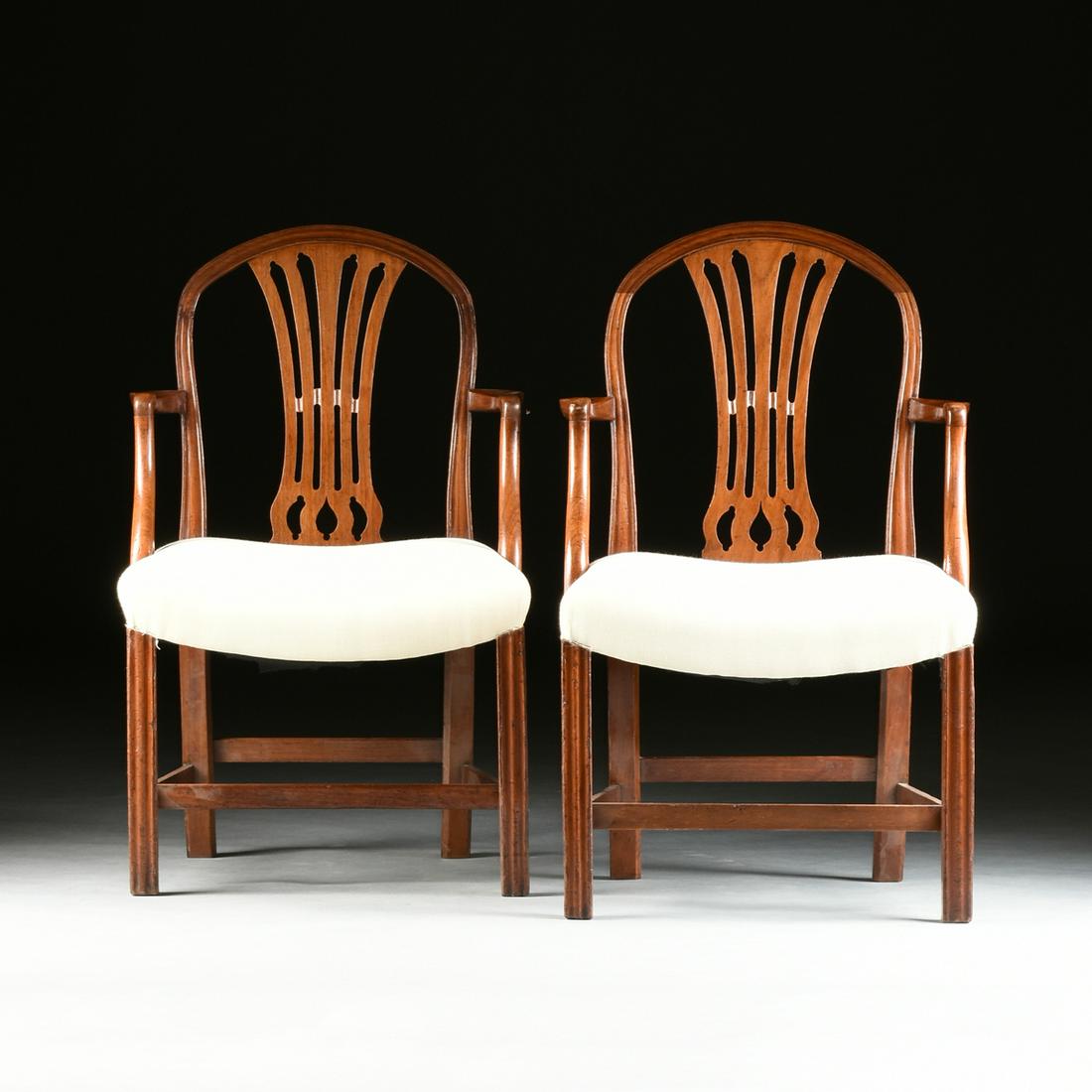 A PAIR OF GEORGE III MAHOGANY ARMCHAIRS, POSSIBLY: A PAIR OF GEORGE III MAHOGANY ARMCHAIRS, POSSIBLY AMERICAN, CIRCA 1800, each with an arched and molded crestrail above a reticulated splat of splayed bands joined by a waved ribbon, flanked by molded 