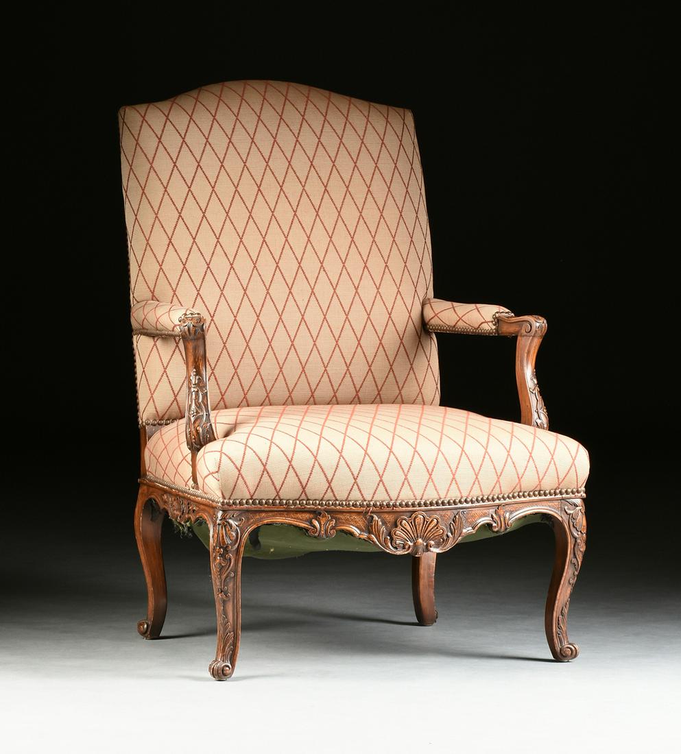 A RÉGENCE STYLE FAUX BOIS BEECH FAUTEUIL À LA REINE,: A RÉGENCE STYLE FAUX BOIS BEECH FAUTEUIL À LA REINE, EARLY 20TH CENTURY, the arched, rectangular, upholstered back, over a bowed seat, within straight, upholstered arms, ending in coquille carved, s