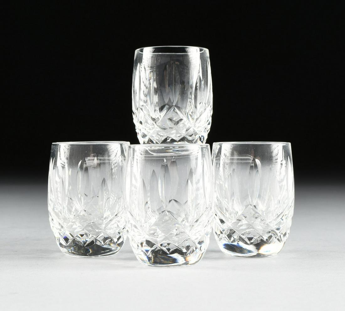 A BRILLIANT CUT CRYSTAL CARAFE TOGETHER WITH FOUR: A BRILLIANT CUT CRYSTAL CARAFE TOGETHER WITH FOUR WATERFORD CUT CRYSTAL SHOT GLASSES IN THE "LISMORE" PATTERN, the carafe with panel cut banded neck with edge cuts over fan and diamond fields of straw