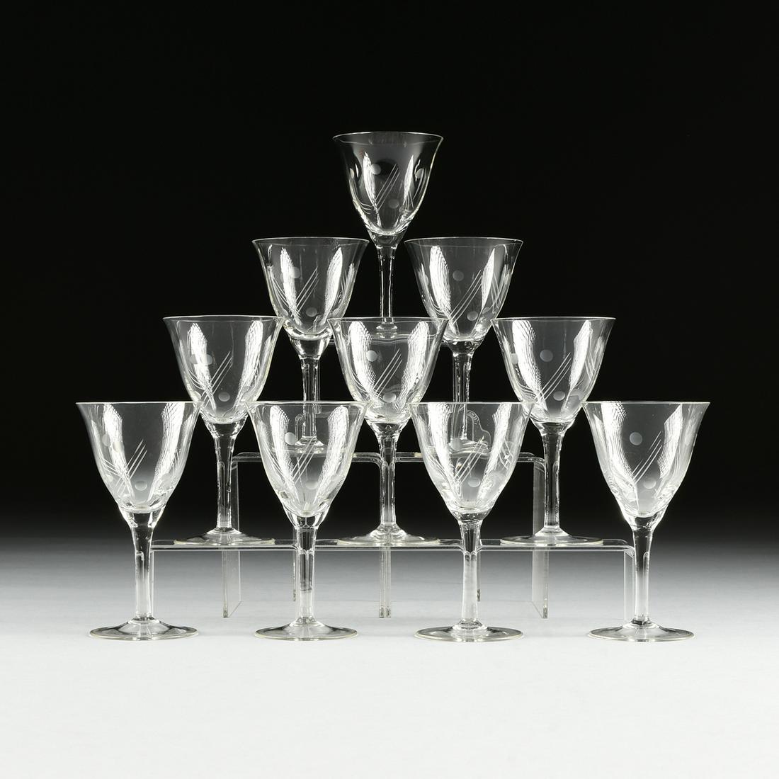 A SET OF TEN CANARY YELLOW DEPRESSION GLASS ETCHED RED: A SET OF TEN CANARY YELLOW DEPRESSION GLASS ETCHED RED WINE GLASSES, CIRCA 1940, the everted lip bell shape bowl raised on slightly waisted stem and spreading foot, with etched dot and line decoration