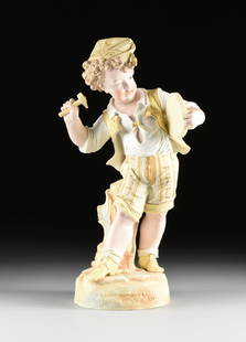 A CONTINENTAL PARCEL GILT BISQUE PORCELAIN FIGURE OF A: A CONTINENTAL PARCEL GILT BISQUE PORCELAIN FIGURE OF A BOY YELLOW, EARLY/MID 20TH CENTURY, the garrison style cap with folded ends and front tassel rests among wild blond curls, over a rosy cheek boy,