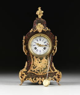 A LOUIS XIV STYLE ORMOLU MOUNTED BOULLE MARQUETRY: A LOUIS XIV STYLE ORMOLU MOUNTED BOULLE MARQUETRY BOUDOIR CLOCK, LATE 19TH CENTURY, of balloon or tête de poupée form and sides covered throughout in stylized foliate brass with engraved details on