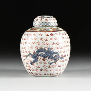 A QIANLONG STYLE FLAMING DRAGON ENAMELED PORCELAIN: A QIANLONG STYLE FLAMING DRAGON ENAMELED PORCELAIN GINGER JAR, 20TH CENTURY, the domed lid with a green and blue dragon over a bulbous tapered body, the collar with insect and bird motif, over a