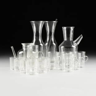 A GROUP OF TWENTY-TWO GLASSES,: A GROUP OF TWENTY-TWO GLASSES, comprising a set of six Wihelm Wagenfeld (German 1900-1990) clear heat resistant glass coffee mugs in the "Jena" pattern, for Jenaer Glaswerk Schott & Genossen, Mainz,