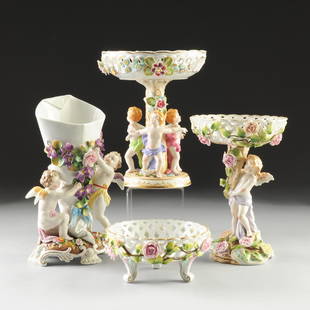 A GROUP OF FOUR GERMAN POLYCHROME DECORATED FLORAL: A GROUP OF FOUR GERMAN POLYCHROME DECORATED FLORAL ENCRUSTED PORCELAIN WARES, TWO BY BROS. VOIGT AND ALFRED VOIGT, SITZENDORF, CIRCA 1887-1900, comprising a reticulated basket form candy dish with