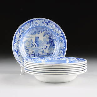 A SET OF EIGHT STAFFORDSHIRE BLUE AND WHITE TRANSFER: A SET OF EIGHT STAFFORDSHIRE BLUE AND WHITE TRANSFER PRINT POTTERY SOUP PLATES, ENGLAND, CIRCA 1830-1840, each with medium blue transfer print decoration in "The Village Church" pattern with "Wild