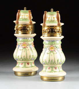 A PAIR OF CONTINENTAL ART NOUVEAU STYLE CERAMIC TWO: A PAIR OF CONTINENTAL ART NOUVEAU STYLE CERAMIC TWO SPOUT BEER TOWERS, POSSIBLY ITALY, MODERN, the baluster form ceramic beer tower with cover with stylized floral decoration on cream ground, on