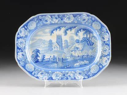 A STAFFORDSHIRE BLUE AND WHITE TRANSFER PRINTED CERAMIC: A STAFFORDSHIRE BLUE AND WHITE TRANSFER PRINTED CERAMIC PLATTER, ENGLAND, CIRCA 1830-1840, rectangular with shaped canted corners and medium blue and white transfer printed decoration in "The Village