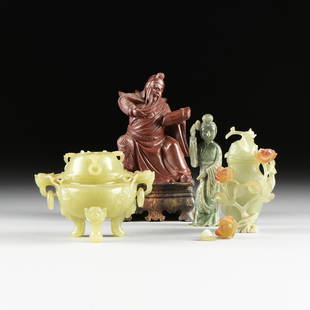 A GROUP OF FOUR CHINESE JADE, JASPER, AND NEPHRITE: A GROUP OF FOUR CHINESE JADE, JASPER, AND NEPHRITE CARVINGS, QING DYNASTY (1644-1912) / REPUBLIC OF CHINA (1912-1949), comprising a light green translucent nephrite lidded, flowering urn, carved to