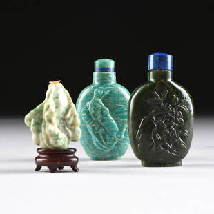 A GROUP OF THREE CHINESE VARIOUS JADES SNUFF BOTTLES,: A GROUP OF THREE CHINESE VARIOUS JADES SNUFF BOTTLES, 20TH CENTURY, comprising a nicely detailed apple green speckled white jade double gourd bottle, with leafy stem suspending miniature gourds in