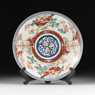 AN ANTIQUE JAPANESE IMARI PARCEL GILT ENAMELED CHARGER,: AN ANTIQUE JAPANESE IMARI PARCEL GILT ENAMELED CHARGER, LATE MEIJI PERIOD (1868-1912), the central seaweed and flower bloom mon style medallion within an iron red band encircled by repeating auspicio