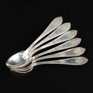 A SET OF TWELVE AMERICAN STERLING SILVER BERRY SPOONS,: A SET OF TWELVE AMERICAN STERLING SILVER BERRY SPOONS, RETAILED BY J.J. FREEMAN, TOLEDO, OHIO, 1900-1930, comprising twelve berry spoons, each handle with exquisitely chased smoking censer or handled