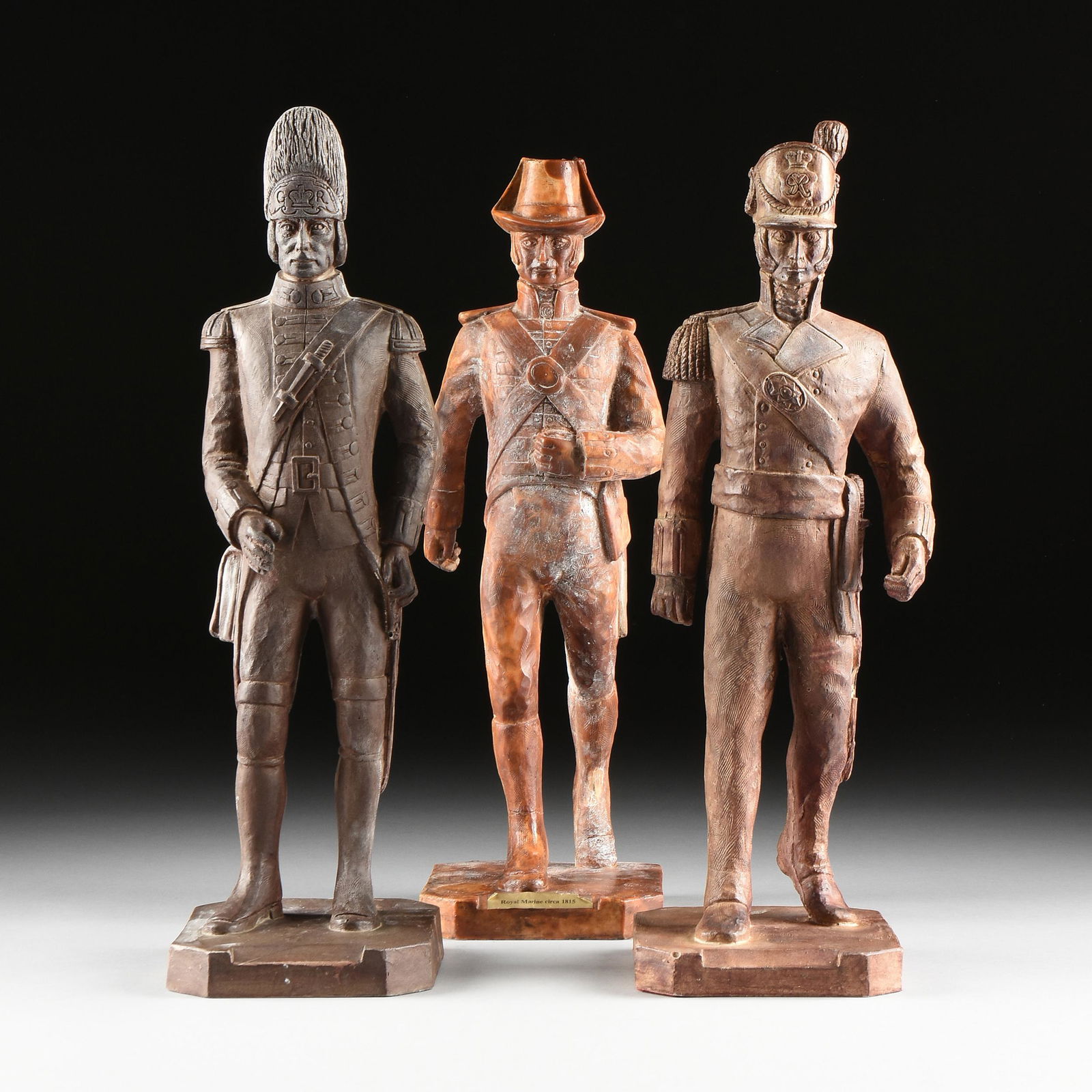 A GROUP OF THREE LARGE CAST RESIN FIGURES OF BRITISH (1 of 19)