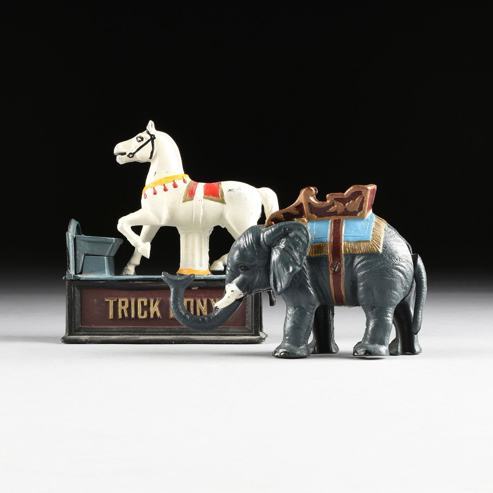 A GROUP OF TWO AMERICAN REPRODUCTION PAINTED CAST IRON (1 of 14)