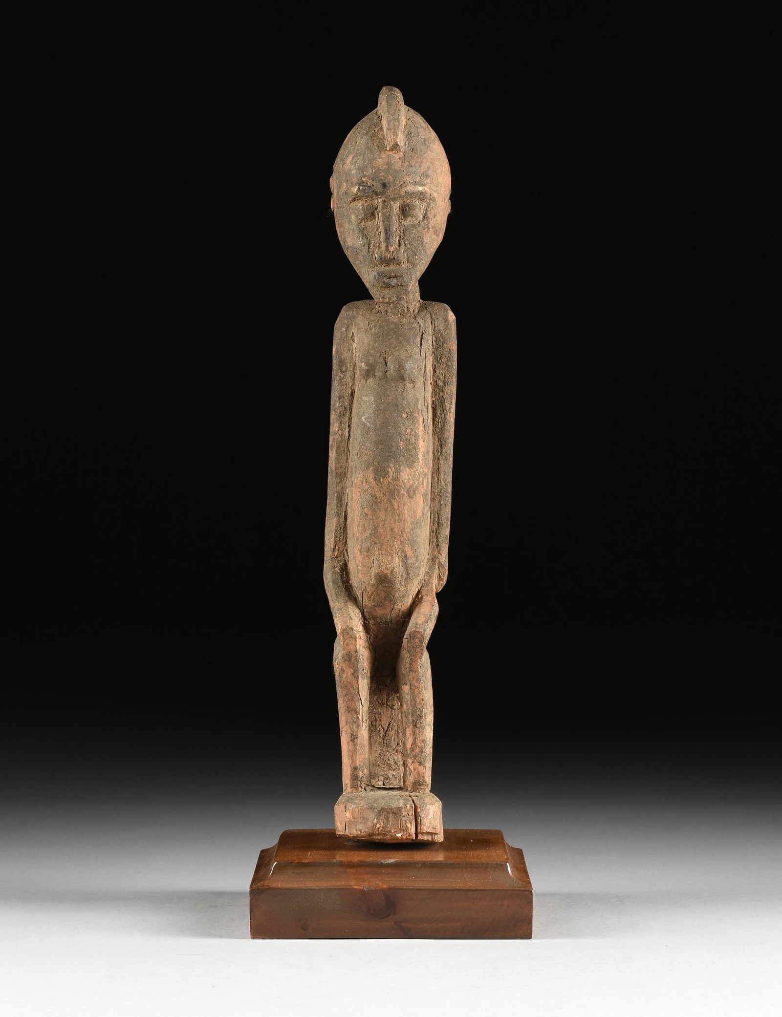 AN AFRICAN WOOD FEMALE FERTILITY FIGURE, PROBABLY (1 of 8)