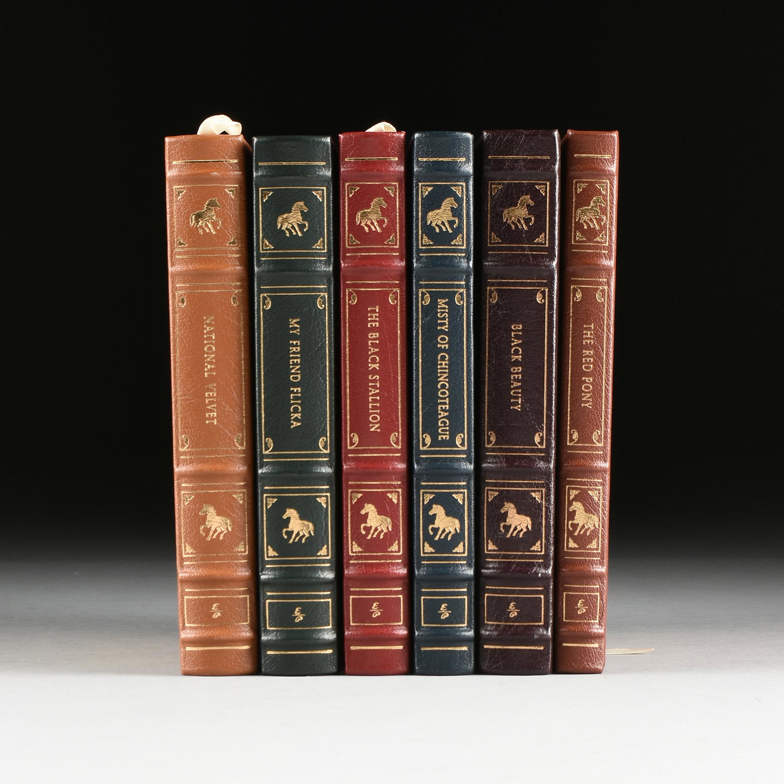 A GROUP OF SIX EASTON PRESS EQUESTRIAN THEMED: A GROUP OF SIX EASTON PRESS EQUESTRIAN THEMED CHILDREN'S TITLES, LATE 20TH CENTURY gilt embossed genuine leather-bound collector's edition works including, The Red Pony, Misty of Chincoteague, Black B