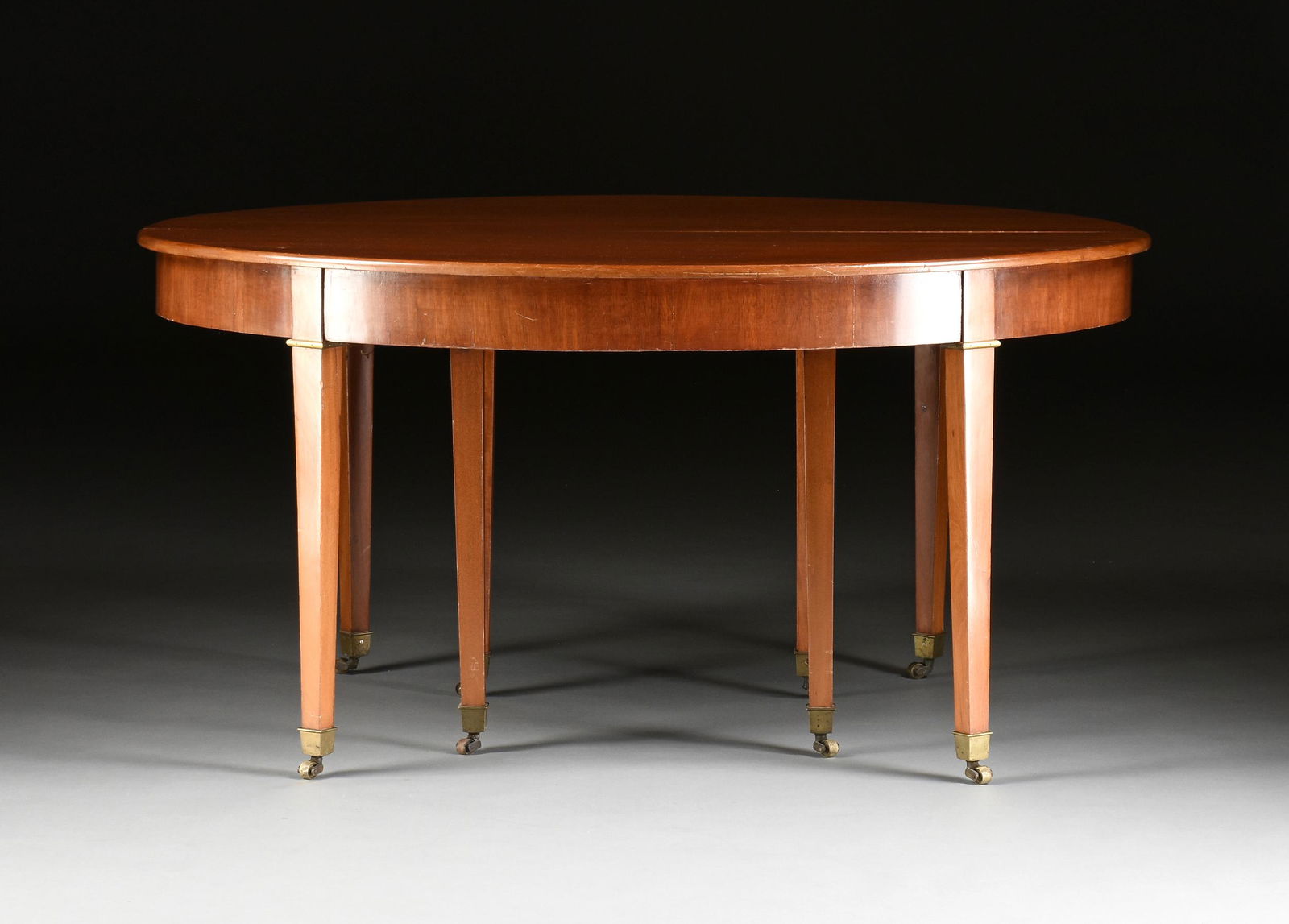 A FRENCH CONSULAT BRONZE MOUNTED MAHOGANY DINING TABLE, (1 of 7)