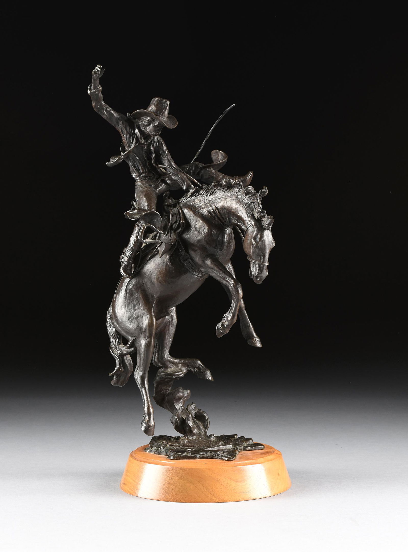 WARREN KELLEY (American 20th Century) A BRONZE COWBOY (1 of 12)