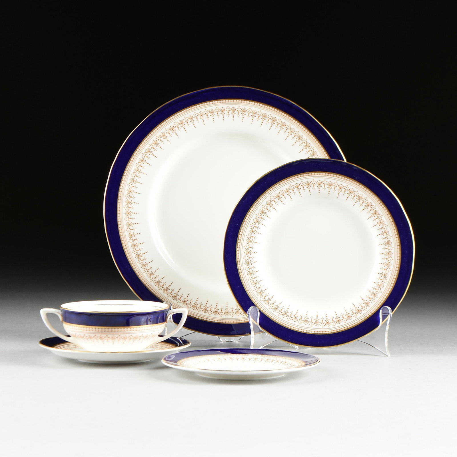 A SIXTY-TWO PIECE ROYAL WORCESTER "REGENCY" PORCELAIN: A SIXTY-TWO PIECE ROYAL WORCESTER "REGENCY" PORCELAIN PART DINNER SERVICE, MARKED, 20TH CENTURY, each piece with traditional deep blue enameled and gilt decoration, verso overglaze light brown crowned