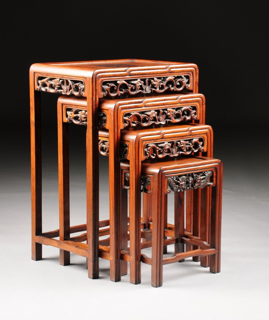 TWO SETS OF VINTAGE CHINESE CARVED HARDWOOD NESTING: TWO SETS OF VINTAGE CHINESE CARVED HARDWOOD NESTING TABLES, 20TH CENTURY, the rectangular inset paneled top above a reeded border continuing to conforming legs connected by a three-sided stretcher, be