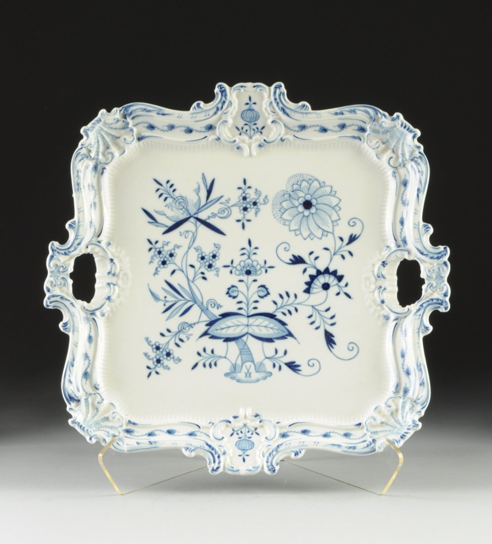 A MEISSEN TWO HANDLE BLUE ONION RECTANGULAR TRAY, BLUE: A MEISSEN TWO HANDLE BLUE ONION RECTANGULAR TRAY, BLUE CROSSED SWORDS MARKS, GREEN GERMANY, PRESSNUMMERS 850, 297 in the Rococo revival taste with shell modeled corners flanking cartouche detailed res