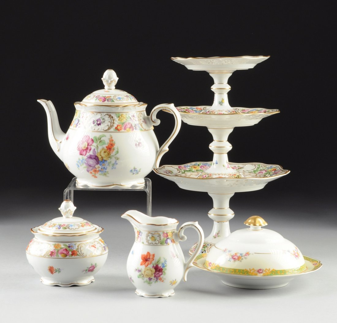 A THREE PIECE SCHUMANN BAVARIAN PORCELAIN TEA SERVICE: A THREE PIECE SCHUMANN BAVARIAN PORCELAIN TEA SERVICE TOGETHER WITH THREE DRESDEN PORCELAIN COMPOTES, the three piece set in the "Empress" pattern, decorated with polychrome painted floral swags, gilt