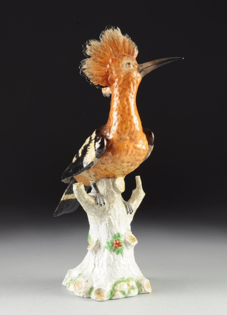 A DRESDEN POLYCHROME ENAMELED MODEL OF A HOOPOE, CARL: A DRESDEN POLYCHROME ENAMELED MODEL OF A HOOPOE, CARL THIEME FACTORY, CIRCA 1914, with naturalistically detailed and decorated plumage resting on a truncated tree trunk, reversing to the underside cen