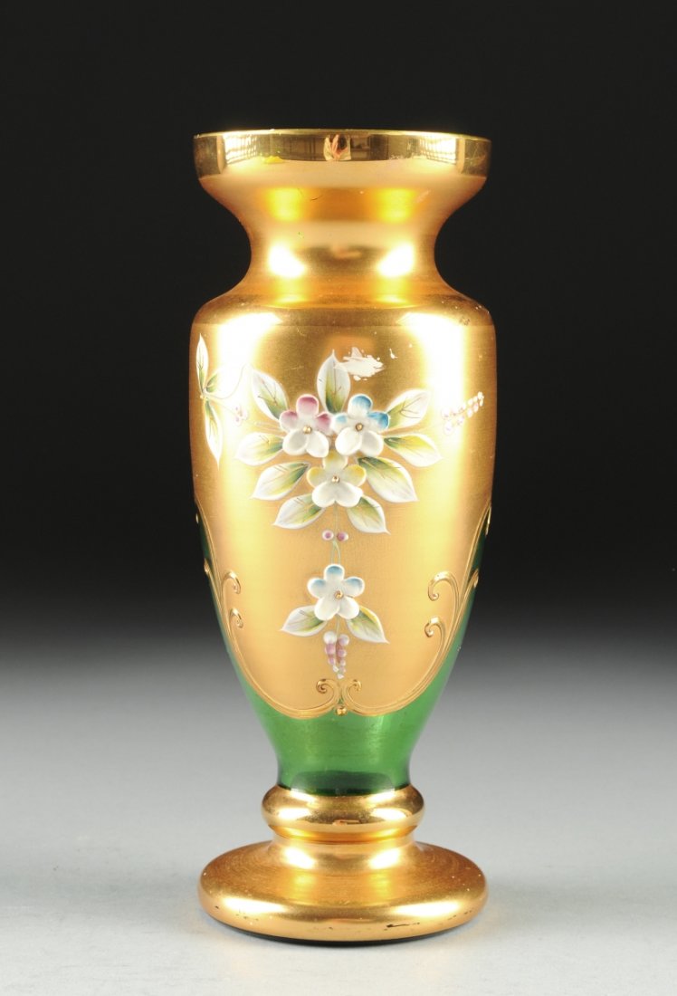 AN EGERMANN HIGH ENAMEL GILT AND GREEN GLASS VASE,: AN EGERMANN HIGH ENAMEL GILT AND GREEN GLASS VASE, CZECH REPUBLIC, 20TH CENTURY, the tall lip with short concave neck, the interior showing peridot green glass with full gilt wash to exterior baluster