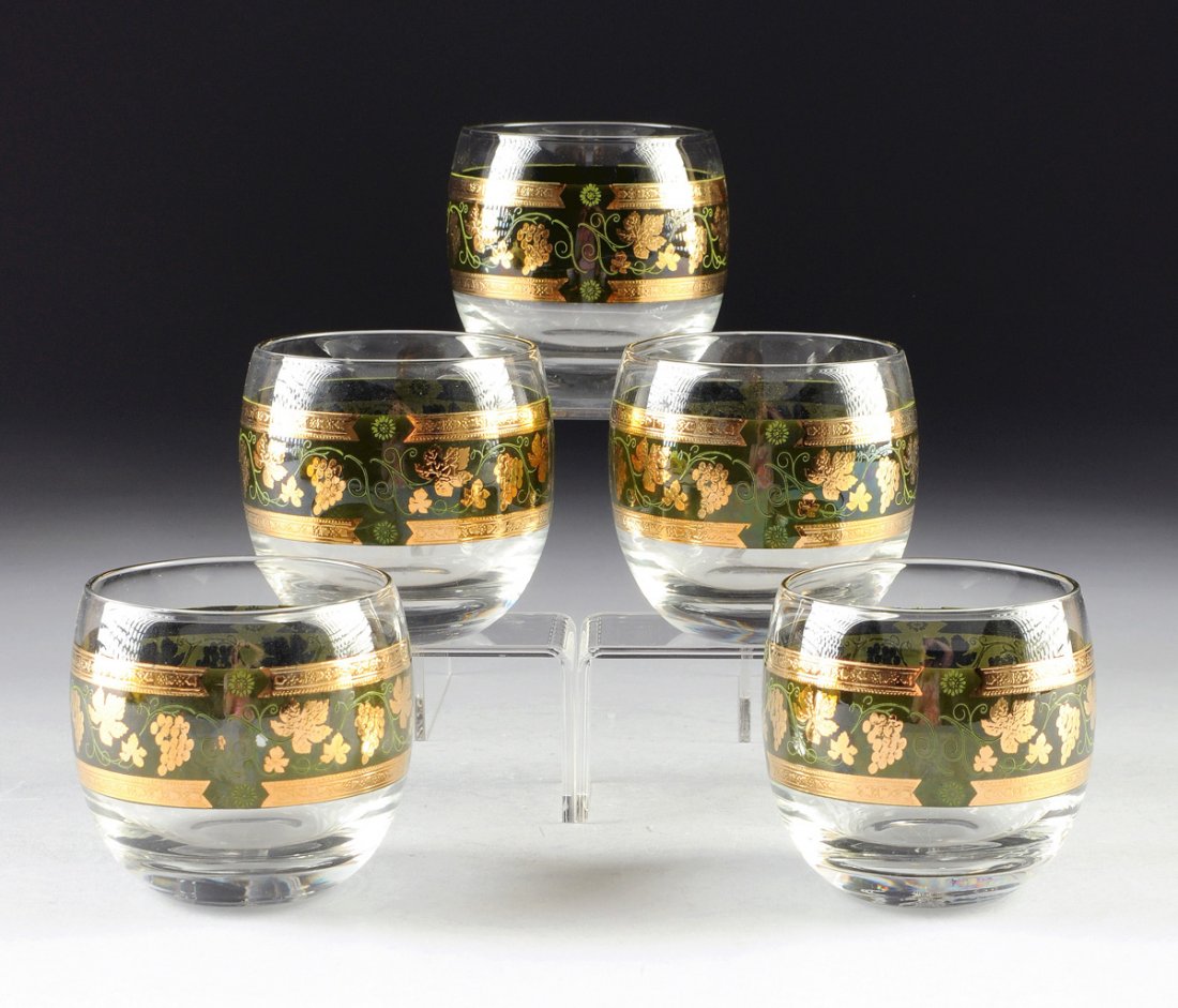 A SET OF FIVE CERA PARCEL GILT AND DARK GREEN GROUND: A SET OF FIVE CERA PARCEL GILT AND DARK GREEN GROUND COCKTAIL GLASSES, LATE 20TH CENTURY, each of bulbous form centering a broad central band of grape cluster and vine, gilt "Cera" signature. Height: 