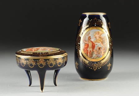 A CZECHOSLOVAKIAN PARCEL GILT AND "JEWELED" POLYCHROME: A CZECHOSLOVAKIAN PARCEL GILT AND "JEWELED" POLYCHROME DECORATED PART VANITY SET, SECOND-QUARTER 20TH CENTURY, each piece in a deep blue ground and centering a circular reserve depicting a