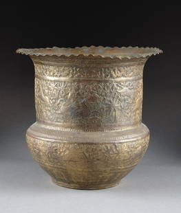 A PERSIAN BRASS JARDINIÈRE, 20TH CENTURY,: A PERSIAN BRASS JARDINIÈRE, 20TH CENTURY, the circular body with long neck and rim on a bulbous tapering base enclosing engraved repoussé scenes of hunters on horseback in pursuit of lions and