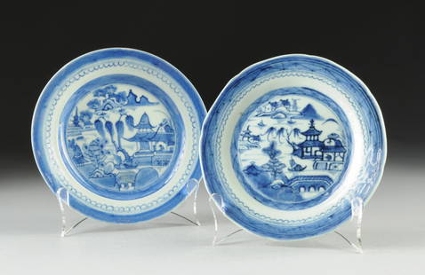 TWO CANTON BLUE AND WHITE PLATES, 18TH CENTURY,: TWO CANTON BLUE AND WHITE PLATES, 18TH CENTURY, each with interiors enameled with pagodas along a lake scene, diameter: 7 1/4"; 7 1/2".