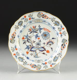 A MEISSEN RICH ONION PATTERN PORCELAIN DESSERT PLATE,: A MEISSEN RICH ONION PATTERN PORCELAIN DESSERT PLATE, 19TH CENTURY, the shaped circular form enclosing traditional underglaze blue decoration and overglaze red with parcel-gilt details, blue crossed