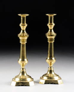 A PAIR OF LARGE SINGLE LIGHT BRASS CANDLESTICKS,: A PAIR OF LARGE SINGLE LIGHT BRASS CANDLESTICKS, PROBABLY 20TH CENTURY, the single cup on a long wide turned stem with domed square base, minor blemishes. Height: 18"