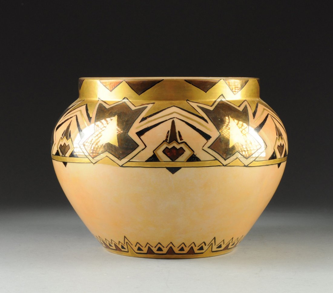 AN ART DECO LUSTER WARE PORCELAIN JARDINIÈRE BY: AN ART DECO LUSTER WARE PORCELAIN JARDINIÈRE BY BERNARDAUD & COMPANY, LIMOGES, FRANCE, the tapered bulbous sides surmounted by a short neck decorated with a broad band of geometric panels alternating