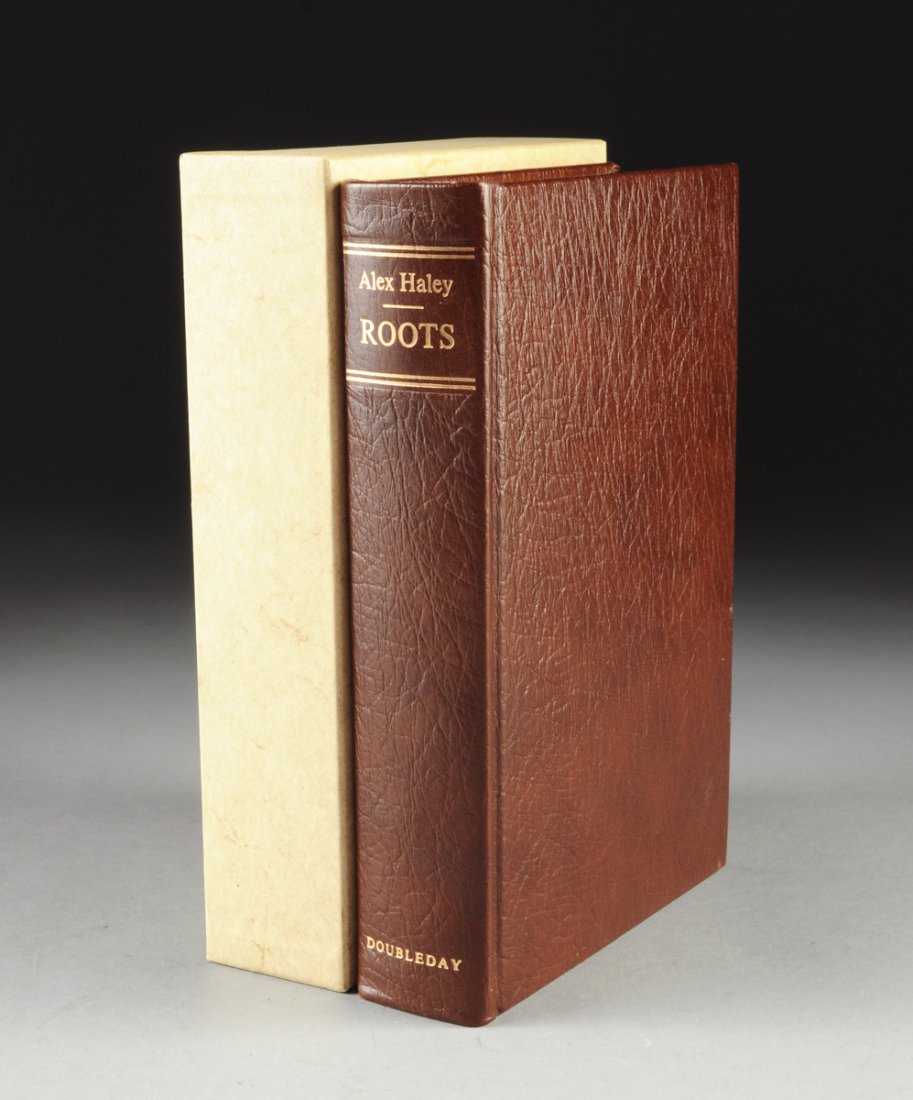 ALEX HALEY (1921-1992) A BOOK, "Roots,": ALEX HALEY (1921-1992) A BOOK, "Roots," Garden City, New York: Double Day & Company, Inc., 1976. Special edition brown leather binding with gilt lettering to spine, with paper board slip case. Number 