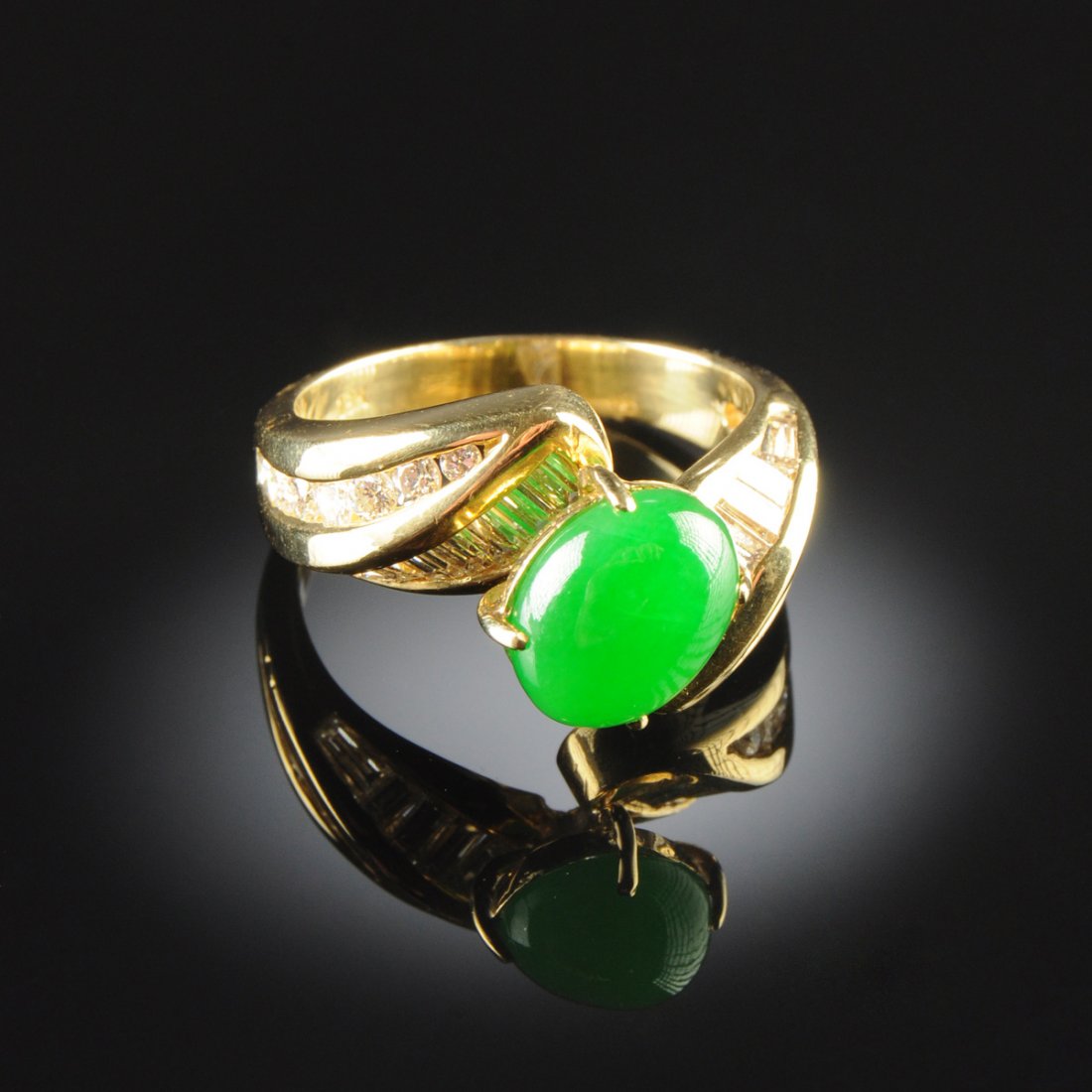 AN 18K GOLD, CHINESE 'A' JADEITE JADE, AND DIAMOND: AN 18K GOLD, CHINESE 'A' JADEITE JADE, AND DIAMOND LADY'S RING, in yellow gold setting with natural, type 'A' jadeite jade oval cabochon measuring approximately 7.3 x 9.1 x 4.2 millimeters, Exceptiona