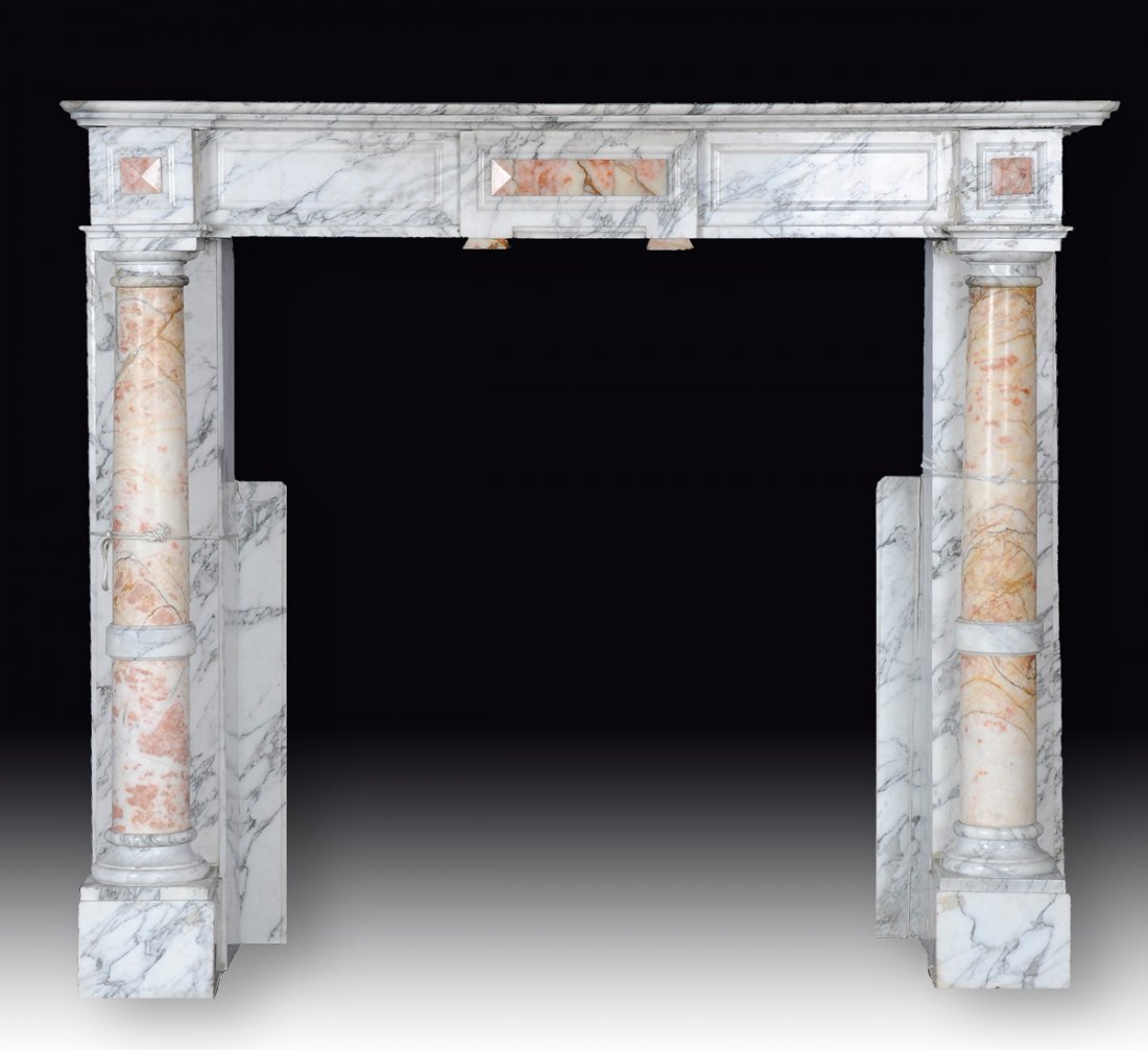 A CONTINENTAL NEOCLASSICAL STYLE GRAY VEINED WHITE: A CONTINENTAL NEOCLASSICAL STYLE GRAY VEINED WHITE MARBLE MANTLE, POSSIBLY ITALIAN, LATE 19TH/EARLY 20TH CENTURY, the rounded rectangular top above a moulded frieze and pink mottled Doric columns encl