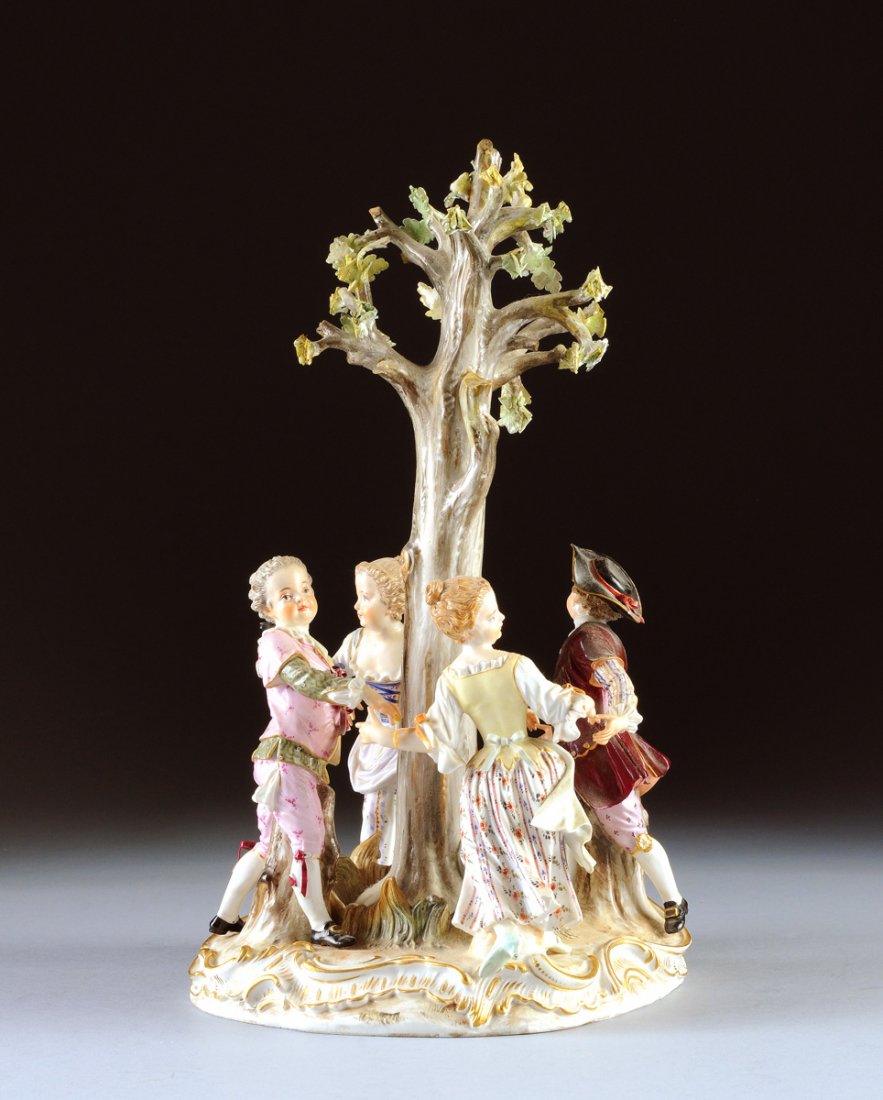 A MEISSEN DANCING CHILDREN FIGURAL GROUP, BLUE CROSSED: A MEISSEN DANCING CHILDREN FIGURAL GROUP, BLUE CROSSED SWORDS MARK, PRESSENUMMER 121, INCISED NUMBER 2798, LATE 19TH/EARLY 20TH CENTURY, modeled as girls and boys enameled in colors wearing 18th Centu