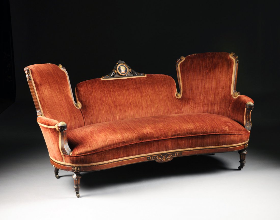 AN AMERICAN RENAISSANCE REVIVAL BRONZE MOUNTED ROSEWOOD: AN AMERICAN RENAISSANCE REVIVAL BRONZE MOUNTED ROSEWOOD AND MAHOGANY SETTEE, PROBABLY BY POTTIER & STYMUS, NEW YORK, THIRD QUARTER 19TH CENTURY, the arched and padded central backrest surmounted by a 