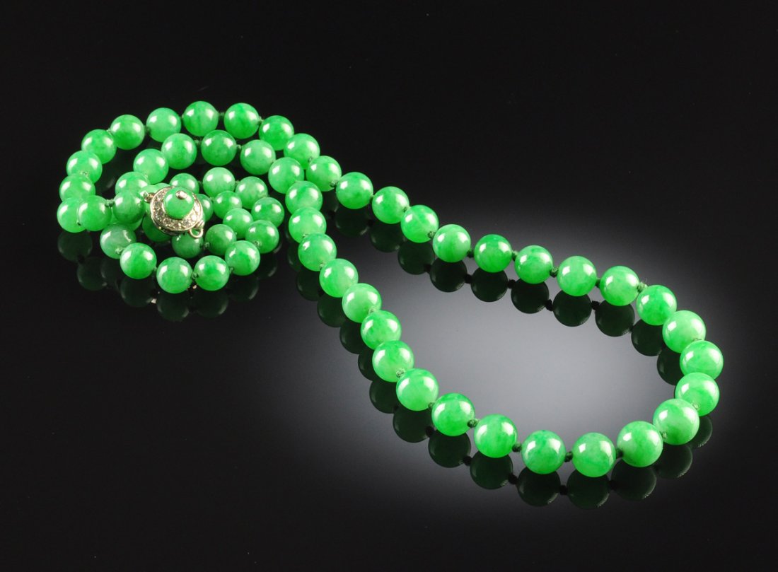 A STRAND OF GREEN CHINESE 'A' JADEITE JADE LADY'S: A STRAND OF GREEN CHINESE 'A' JADEITE JADE LADY'S BEADS, consisting of 65 natural, type 'A' jadeite jade spherical beads, 20" in length, full drilled, measuring from approximately 5 to 8 millimeters i