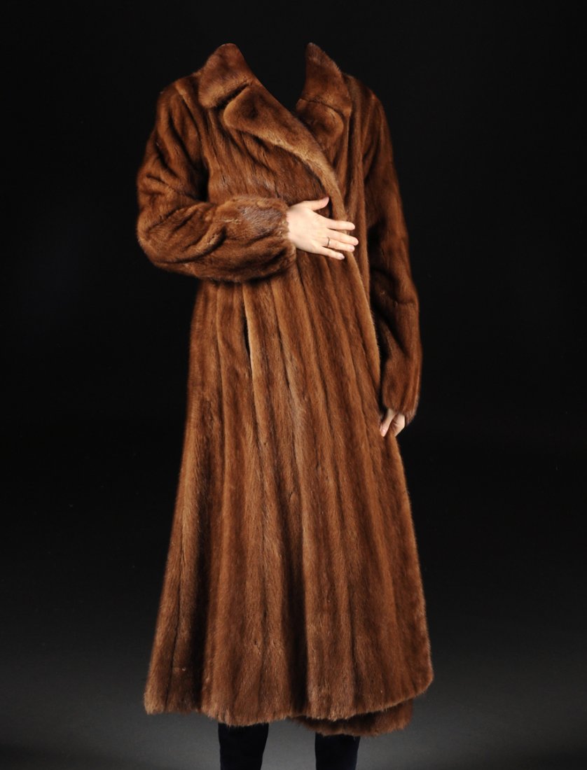 A LADY'S FULL-LENGTH BROWN MINK COAT, BY DAVID OF NEW: A LADY'S FULL-LENGTH BROWN MINK COAT, BY DAVID OF NEW YORK, 20TH CENTURY, with a short split lapel collar above long sleeves and sides concealing two hidden slot pockets, silk hook and loop fasteners,