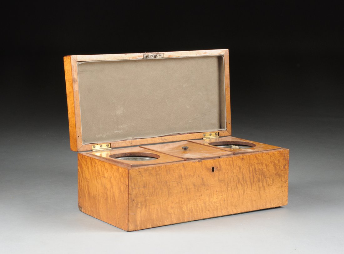 AN ANTIQUE AMERICAN RIBBON MAPLE TEA CADDY, 19TH: AN ANTIQUE AMERICAN RIBBON MAPLE TEA CADDY, 19TH CENTURY, of rectangular form with hinged lid opening to two conforming tea leaf storage tin lined and lidded compartments flanking a third mixing compa