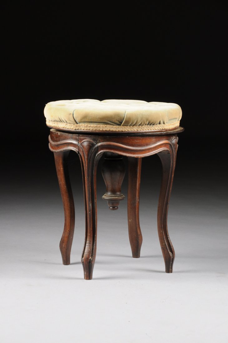 AN AMERICAN LATE CLASSICAL ROSEWOOD PIANO STOOL, CIRCA: AN AMERICAN LATE CLASSICAL ROSEWOOD PIANO STOOL, CIRCA 1835, in the Louis XVI style with a circular button-tufted velvet seat above a serpentine seat rail, enclosing an inverted baluster form finial a