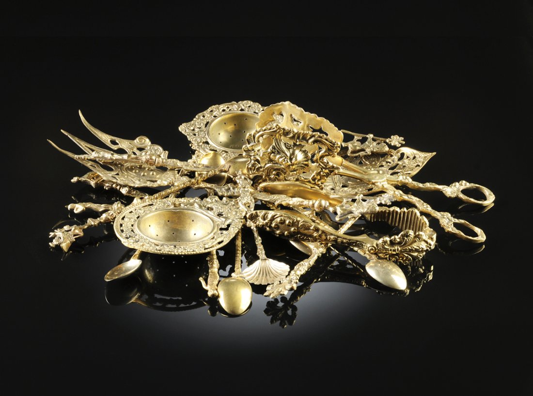 A COLLECTION OF ITALIAN BRASS SERVING UTENSILS AND: A COLLECTION OF ITALIAN BRASS SERVING UTENSILS AND TEASPOONS, LATE 19TH AND 20TH CENTURIES, comprising three large soup ladles, the largest 15" in length, one in silver plate impressed "J. L. Silverpl
