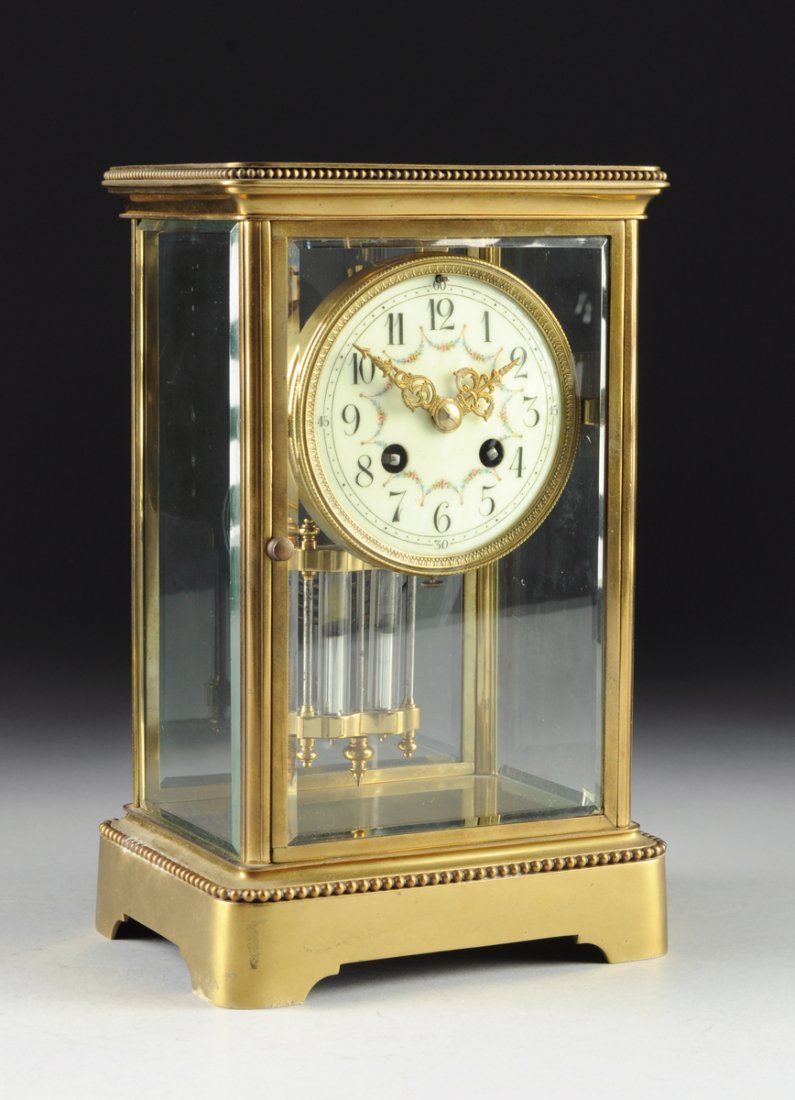 A FRENCH MARTI ET CIE GLASS CASED REGULATOR MANTLE: A FRENCH MARTI ET CIE GLASS CASED REGULATOR MANTLE CLOCK, CIRCA 1889, the brass case with beaded trim and beveled glass sides, dual mercury filled vial pendulum, the enameled porcelain dial with large
