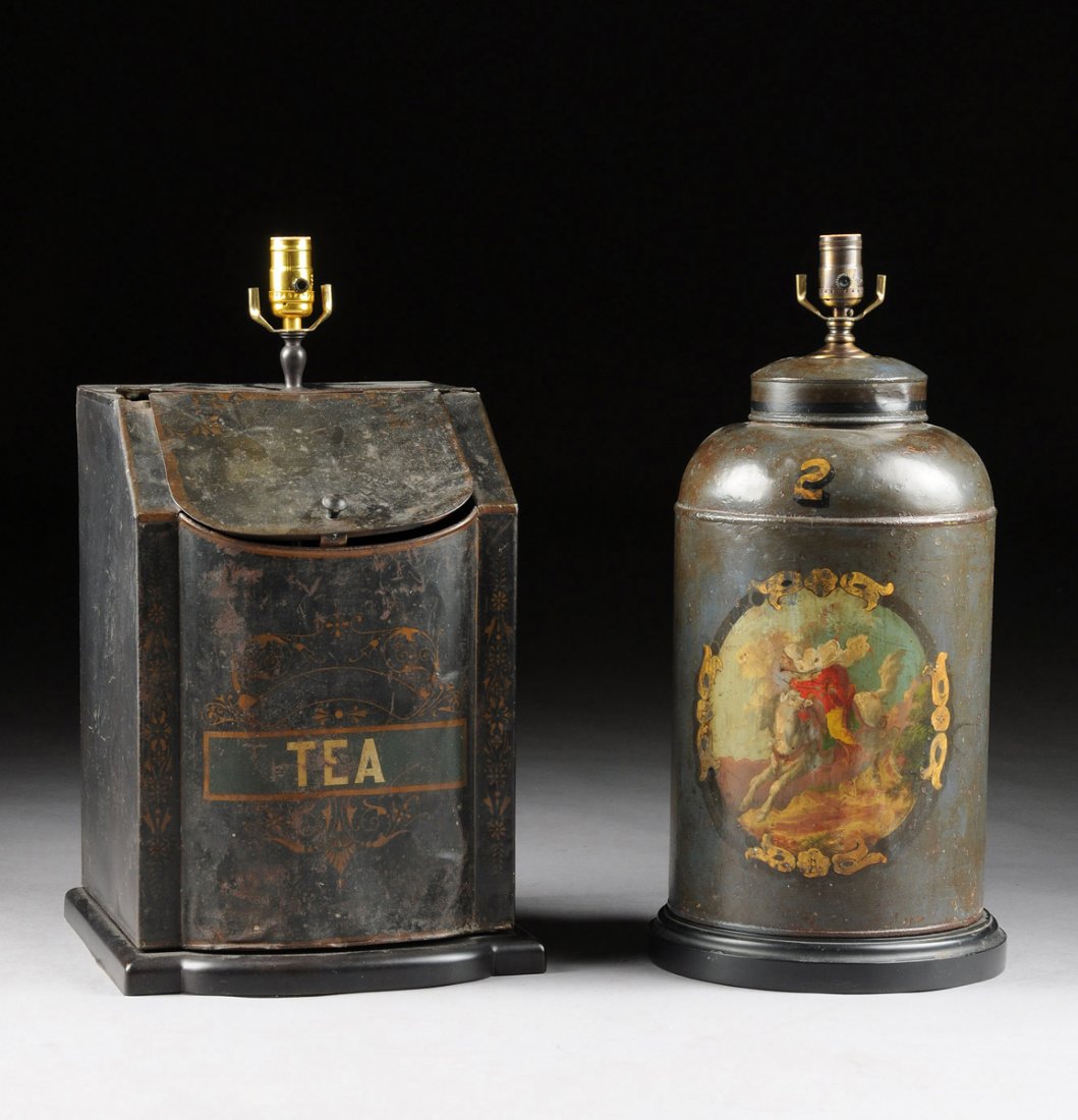 TWO LARGE ANTIQUE PARCEL GILT AND POLYCHROME PAINTED: TWO LARGE ANTIQUE PARCEL GILT AND POLYCHROME PAINTED TOLE CANISTERS, LATE 19TH/EARLY 20TH CENTURY, one having a bowed breakfront centering gilt stenciled scrolling foliate decoration enclosing the whi