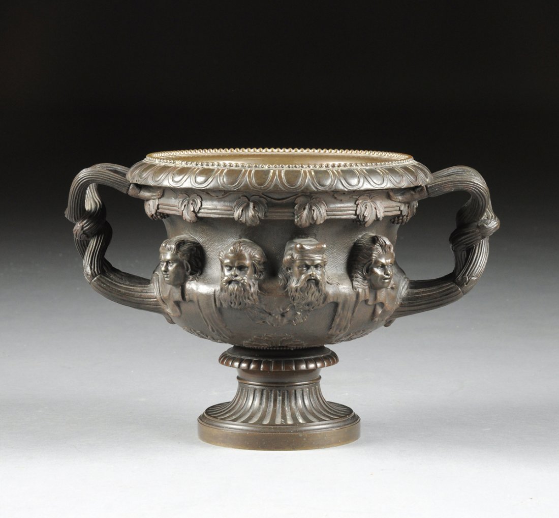 A CONTINENTAL PATINATED BRONZE WARWICK VASE, POSSIBLY: A CONTINENTAL PATINATED BRONZE WARWICK VASE, POSSIBLY FRENCH, LATE 19TH/EARLY 20TH CENTURY, finely cast with a beaded lappet cast rim above a reeded band of grape leaf and clusters, over classical bea