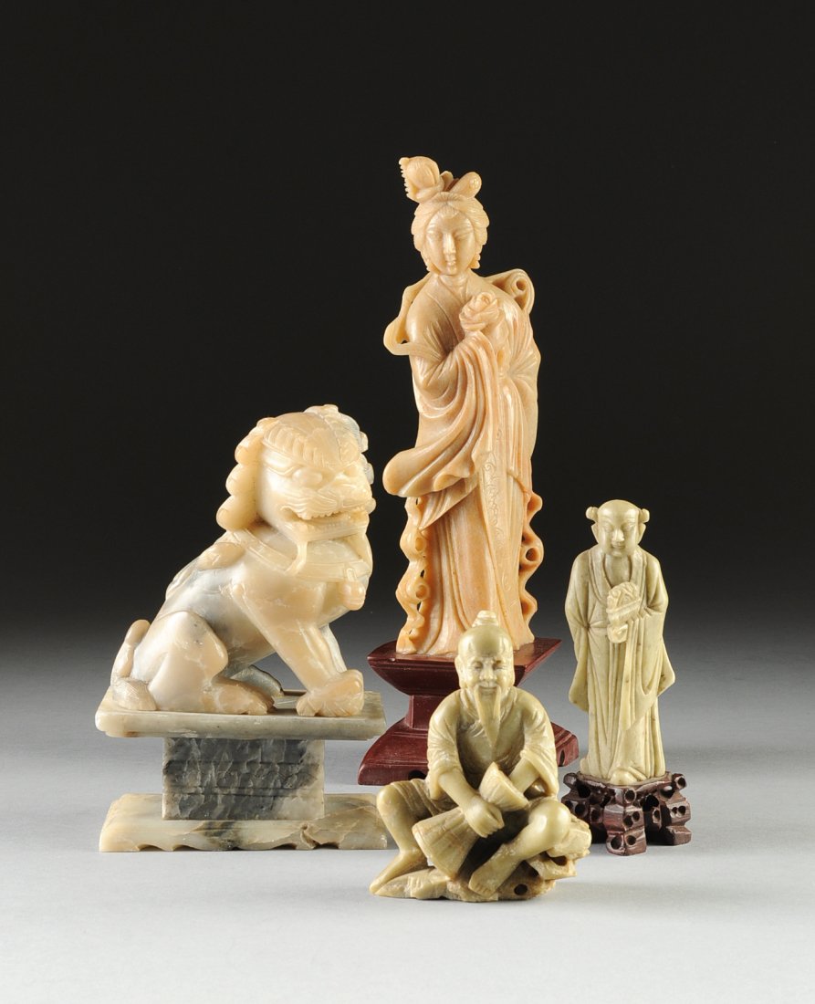 A GROUP OF FOUR CHINESE CARVED SOAPSTONE FIGURES,: A GROUP OF FOUR CHINESE CARVED SOAPSTONE FIGURES, comprising a celadon green seated figure of a smiling bearded basket weaver working on a shaped vessel between his legs, height: 4 3/8"; a celadon gre